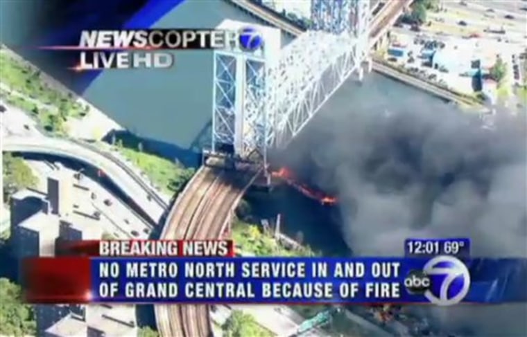 This frame capture from video released by WABC-TV in New York shows fire and smoke beneath the 138th Street lift bridge on the Harlem River on Monday.